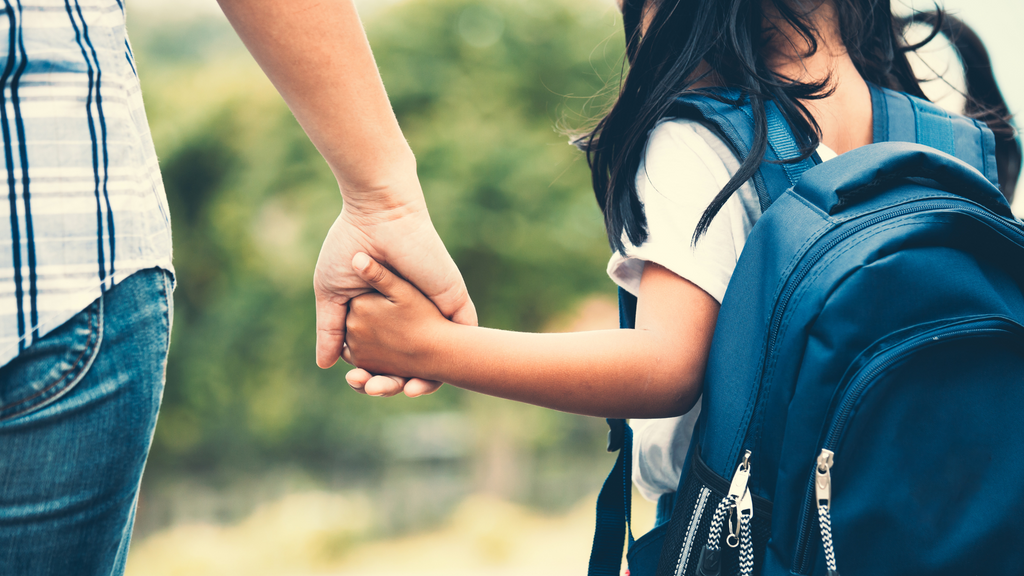 Back to School Tips and Trick for Busy Moms | Mom Holding Child's Hand Going to School